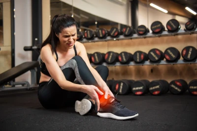 Muscle Cramps A person massaging their leg to relieve muscle cramp after exercise